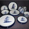 Windswept Pine in Blue with blue and green rim
 Dinnerware   4 piece place setting includes dinner plate and a mug the other 2 pieces may be 2 bowls, 2 plates or combination $135 or choose a 
set of bowls or dessert plates 