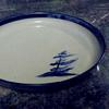 Georgian Bay Windswept pine tree in blue serving plate 13" diameter
  Dinnerware 
4 piece place setting includes dinner plate and a mug the other 2 pieces may be 2 bowls, 2 plates or combination $135 or choose a 
set of bowls or dessert plates 